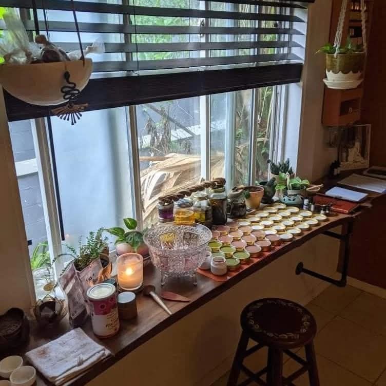 Sunlit apothecary window with herbal preparations