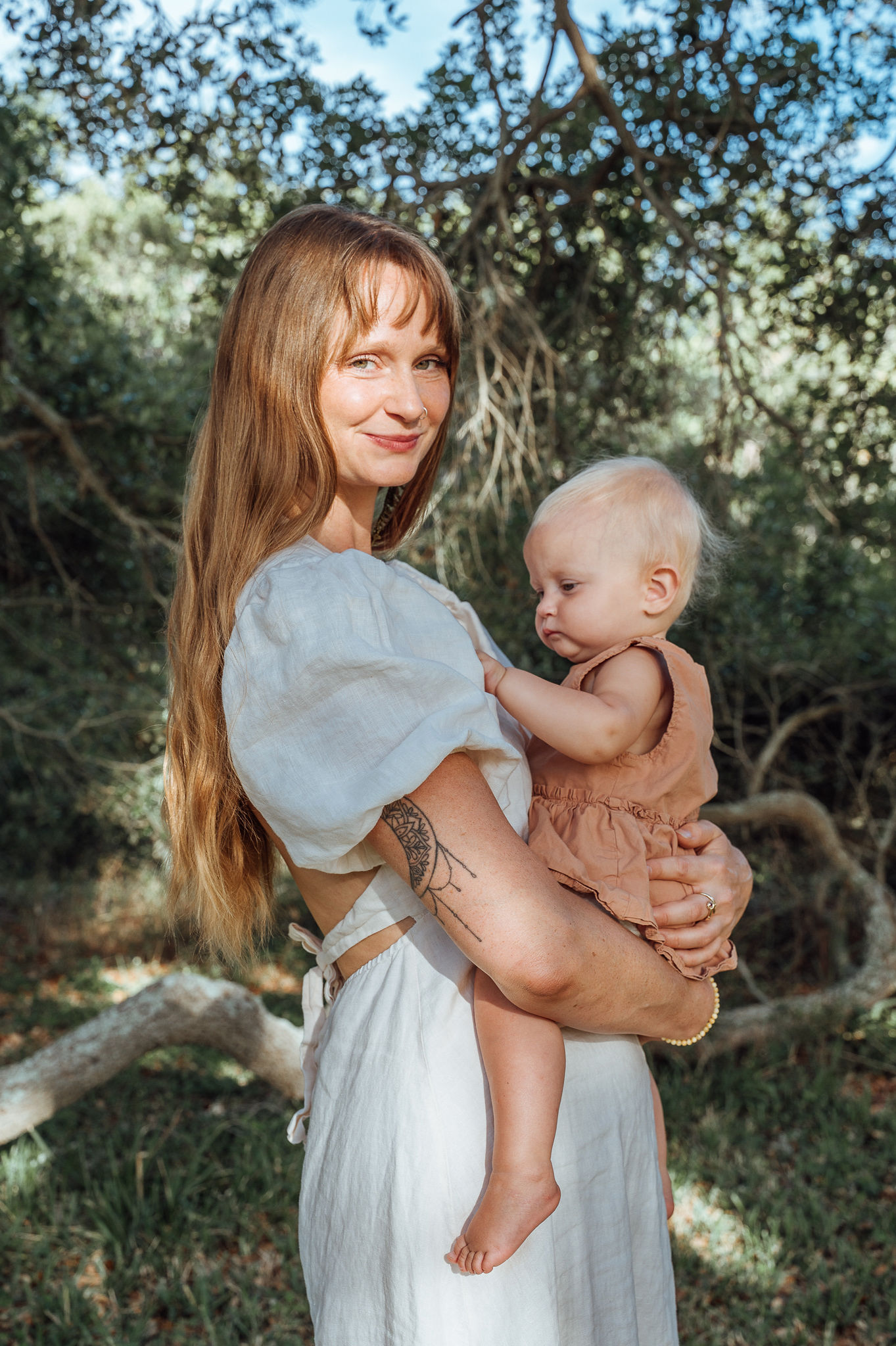 Kelli Harper outdoors with her daughter