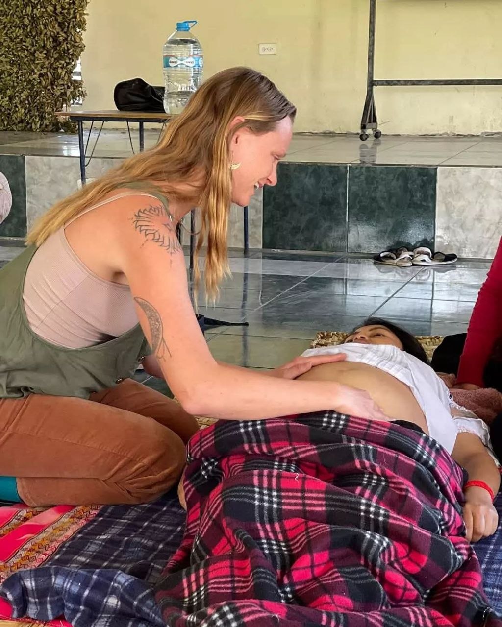 Kelli providing hands-on care during a postpartum visit