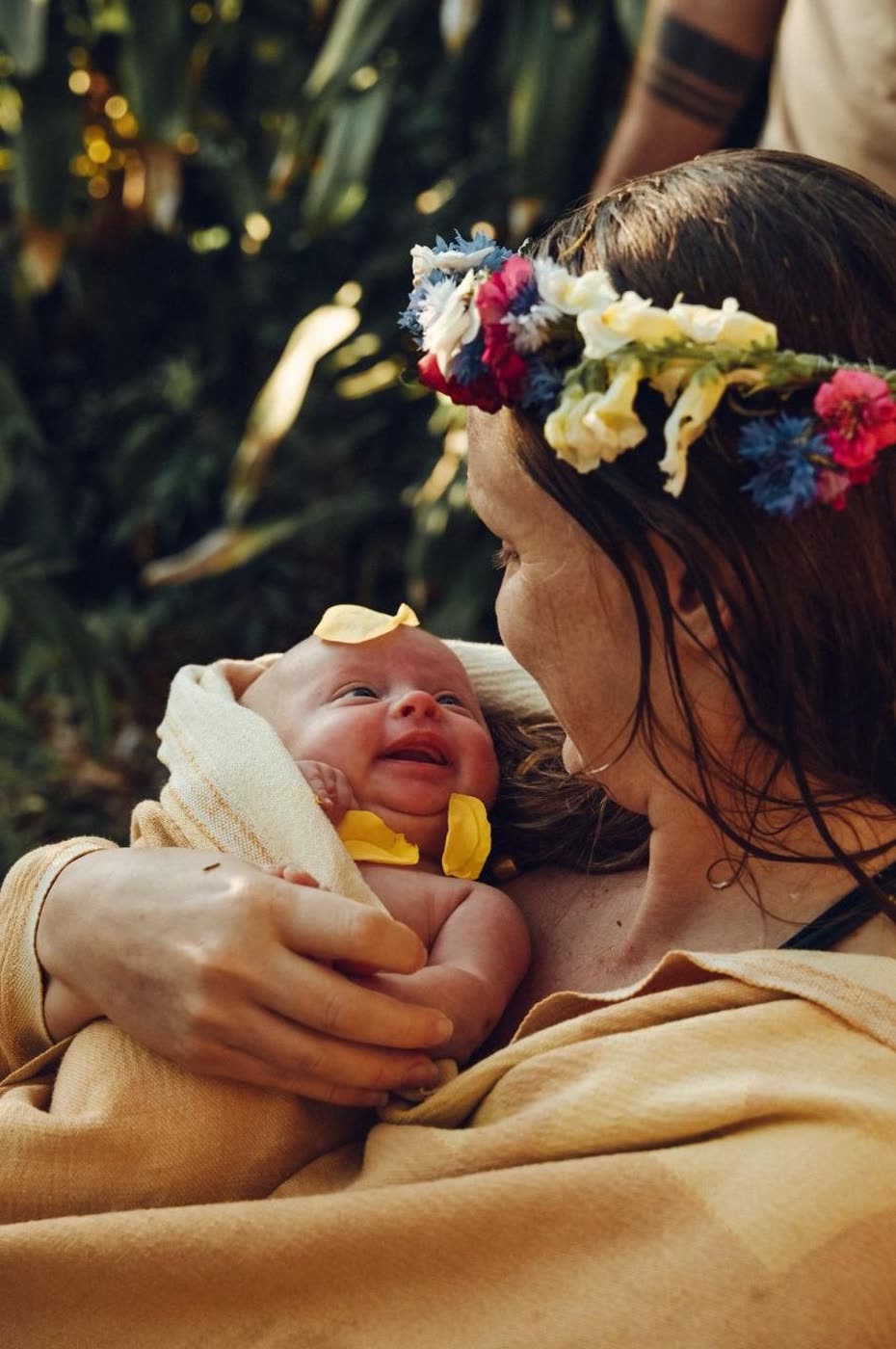 Kelli with a newborn, floral crown